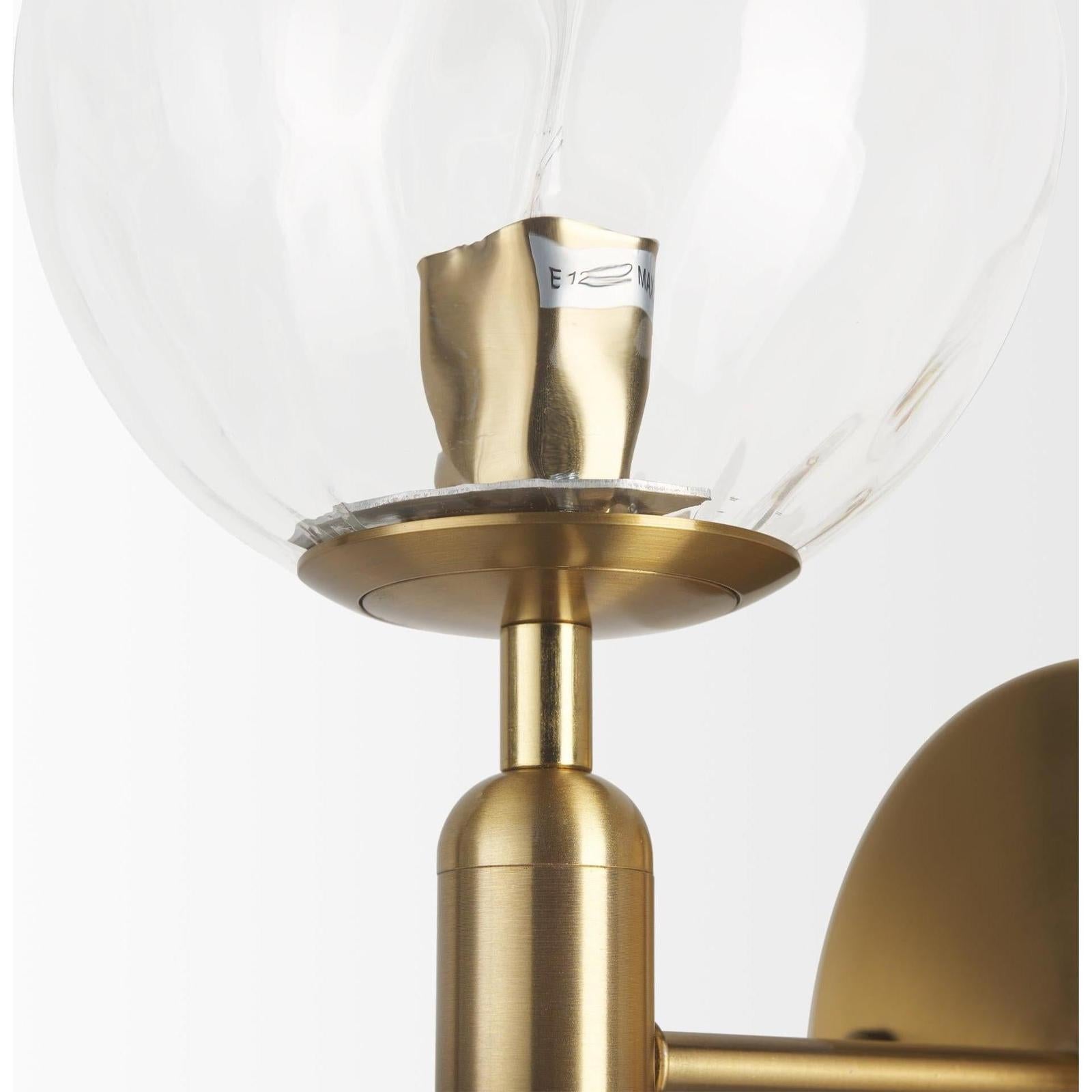 Mercana Britton Gold Metal w/ Clear Glass Globe 1-Light Wall Sconce Clearance