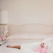 Joan Collins Relaxes By Slim Aarons