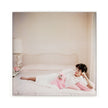 Joan Collins Relaxes By Slim Aarons