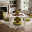 Dining room with a table and chairs, featuring a backgammon board.