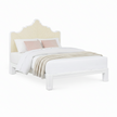A coastal bed with a white wood frame, carved into a nicely curved shape